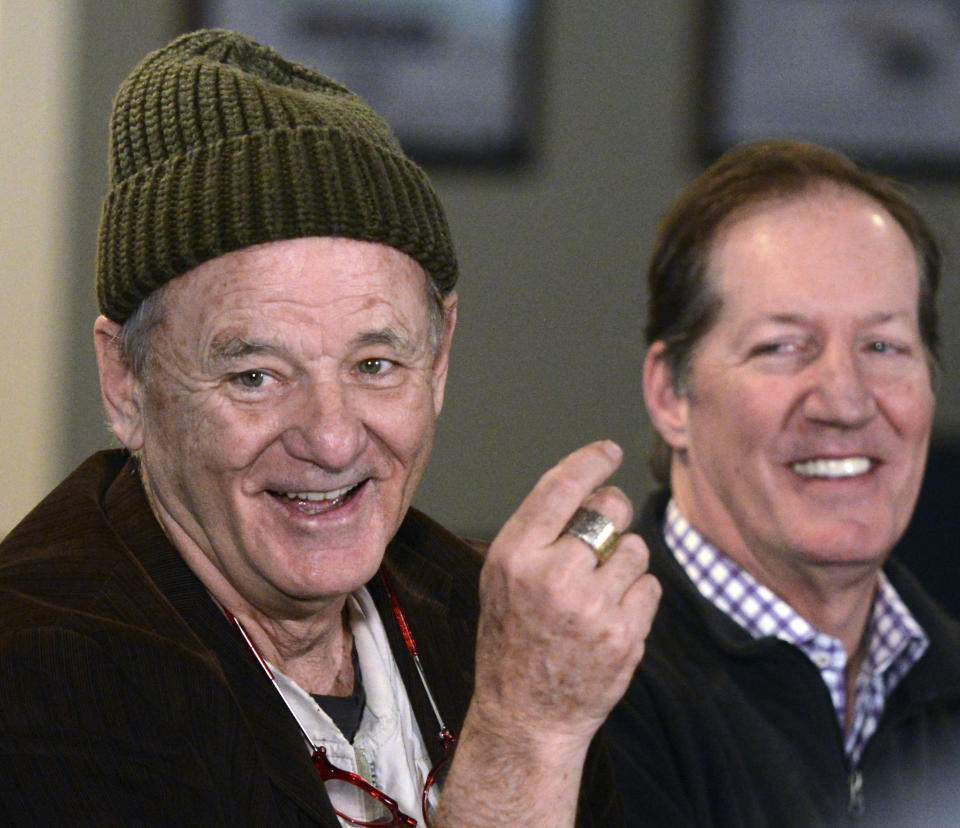 FILE - In this April 17, 2018, file photo, actor Bill Murray, star of the 1980 film, "Caddyshack," appears at a news conference for his new golf-themed Murray Bros. Caddyshack Restaurant, with CEO and co-founder Mac Haskell, right, in Rosemont, Ill. "Caddyshack" starring Murray was No. 4 in The Associated Press’ Top 25 favorite sports movies poll. (Rick West/Daily Herald via AP)