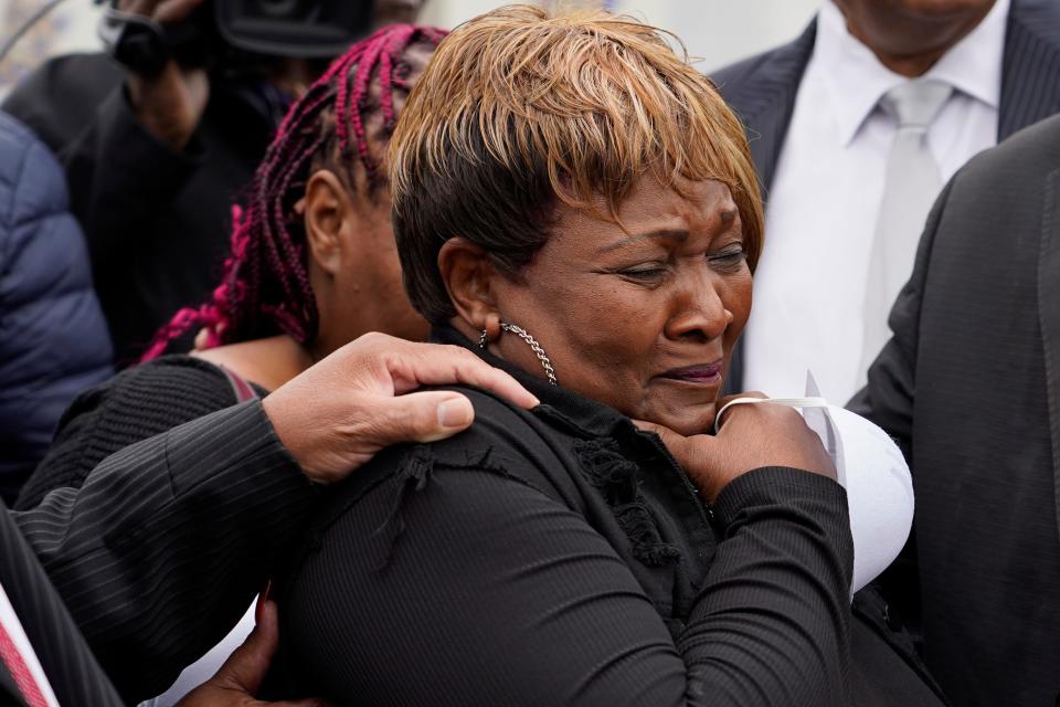Bettersten Wade, mother of Dexter Wade, a 37-year-old man who died after being hit by a Jackson, Miss., police SUV driven by an off-duty officer, cries while watching her son's body transferred to a mortuary transport, after being exhumed from a pauper's cemetery near the Hinds County Penal Farm in Raymond, Monday, Nov. 13, 2023. Civil rights attorney Ben Crump said Monday he is asking for a federal investigation as to why authorities waited several months to notify the family of Wade's death. (AP Photo/Rogelio V. Solis)