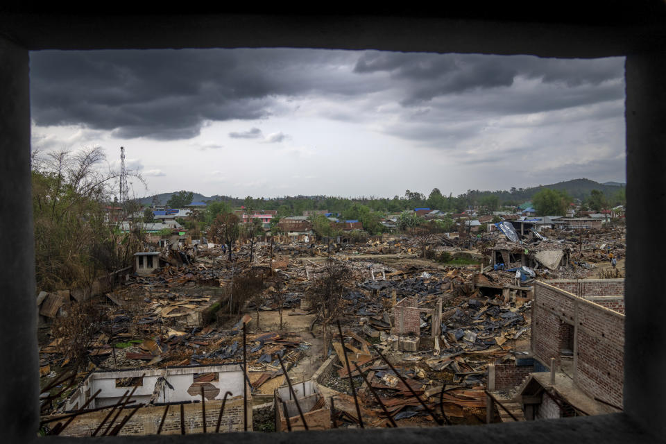 Houses are seen burnt following ethnic clashes and rioting in Sugnu, in the northeastern Indian state of Manipur, Wednesday, June 21, 2023. Manipur has been reeling under a spree of killings, arson and a rampage of hate after Christian Kukis and mostly Hindu Meiteis began clashing against each other in May. A video that went viral late Wednesday, July 19, is emblematic of the deadly conflict. The video shows two naked women being surrounded by scores of young men who grope their private parts and drag them to a nearby field. (AP Photo/Altaf Qadri)