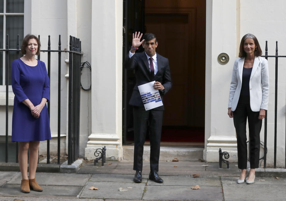 Britain's Chancellor of the Exchequer Rishi Sunak, centre, poses for photographers with Dame Carolyn Julie Fairbairn, right, Director General of the CBI, Confederation of British Industry, and Frances O'Grady, General Secretary of the TUC, Trades Union Congress, outside No 11 Downing Street, before heading for the House of Commons to give MPs details of his Winter Economy Plan, in London, Thursday Sept. 24, 2020. (AP Photo/Frank Augstein)