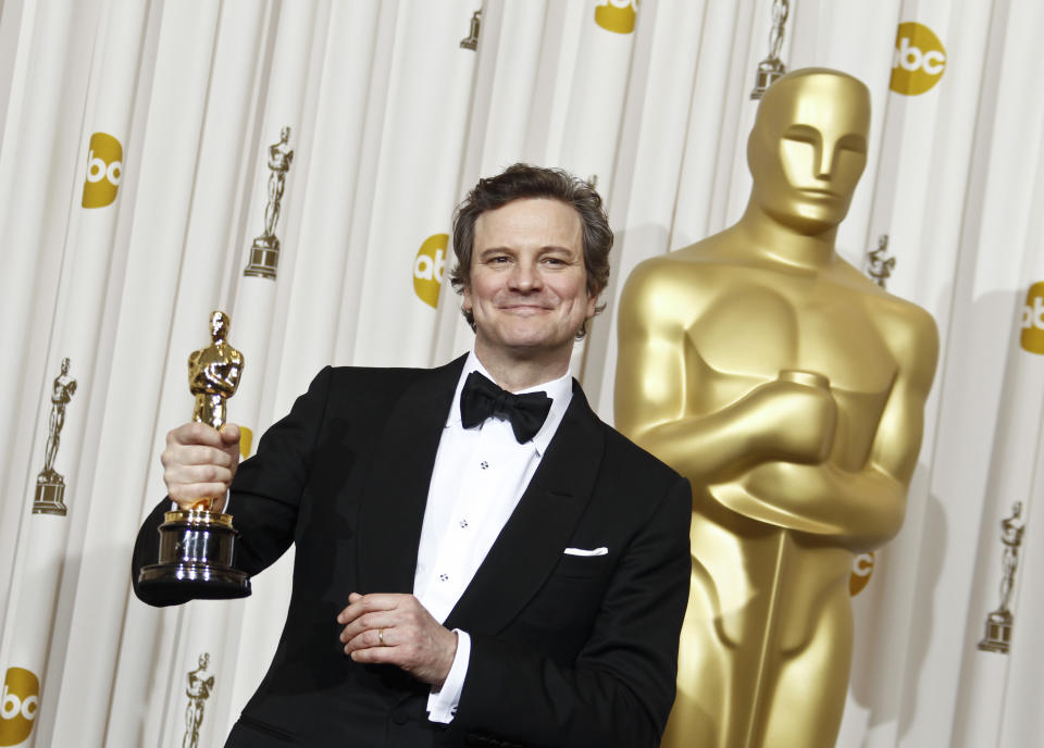 Colin Firth poses backstage with the Oscar