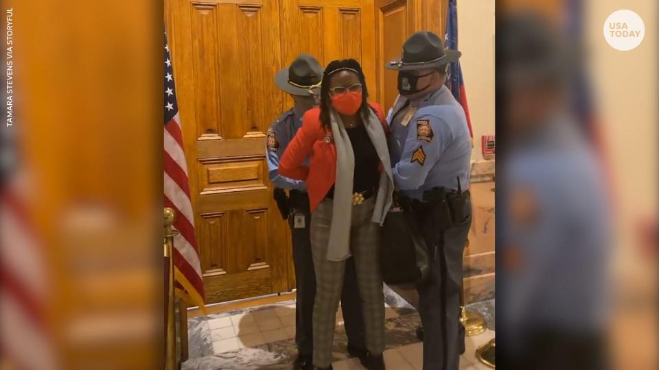 Democratic state Rep. Park Cannon was arrested after knocking on the door of Governor Brian Kemp's office as he signed the elections legislation.
