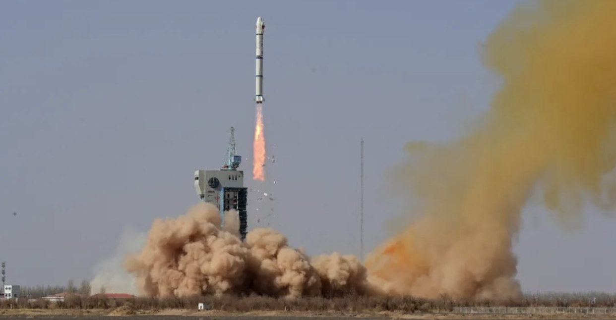  Insulation tiles fall from a Chinese Long March 2C rocket carrying the Horus 2 satellite as it rises from the launch pad at Jiuquan spaceport on March 13, 2023. 