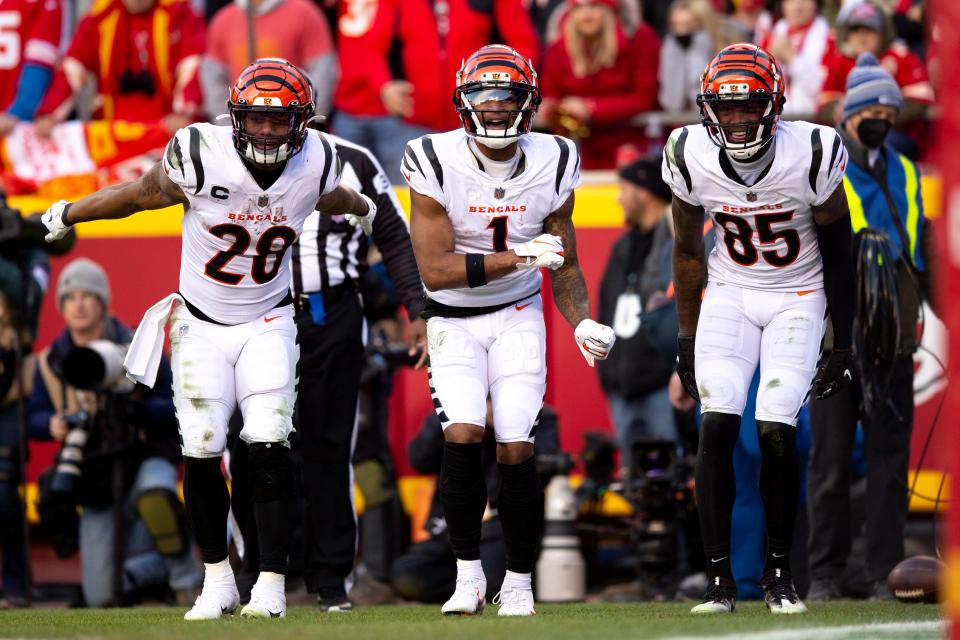 Cincinnati Bengals wide receiver Ja'Marr Chase, center, dances with running back Joe Mixon, left, and wide receiver Tee Higgins after scoring a touchdown in the AFC Championship Game against the Kansas City Chiefs in January 2022. The Bengals were on their way to Super Bowl 56.