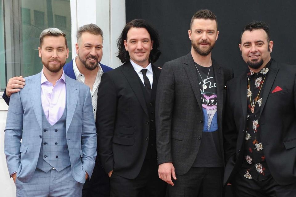 <p>Albert L. Ortega/Getty</p> *NSYNC in Los Angeles in April 2018