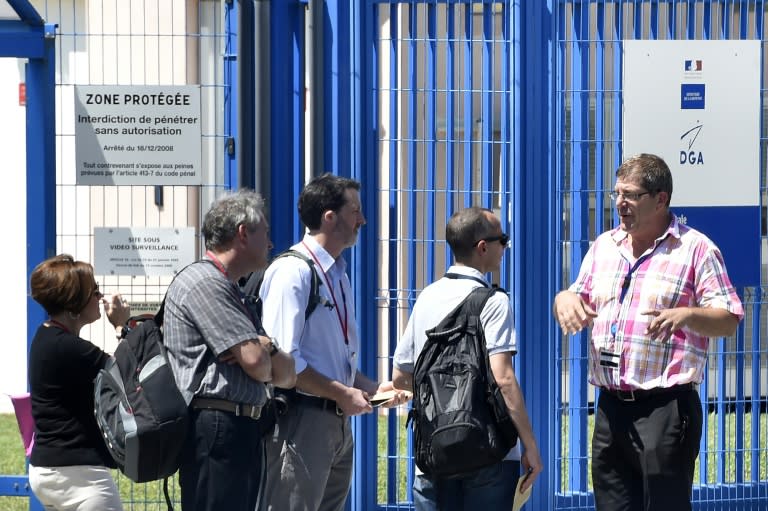 French aviation experts arrive at the Directorate General of Armaments Aeronautical Technical Center in Balma, near Toulouse, where a washed-up plane part found on the French Indian Ocean island of La Reunion is being analysed on August 5, 2015