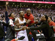 Toronto Raptors forward Kawhi Leonard, second from left, celebrates his game-winning basket as time expired at the end of an NBA Eastern Conference semifinal basketball game against the Philadelphia 76ers, in Toronto on Sunday, May 12, 2019. Toronto won 92-90. (Frank Gunn/The Canadian Press via AP)