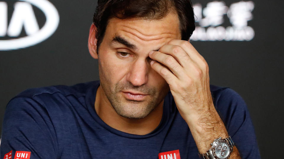 Roger Federer reacts during a press conference after losing to Stefanos Tsitsipas. (Photo by DAVID GRAY/AFP/Getty Images)