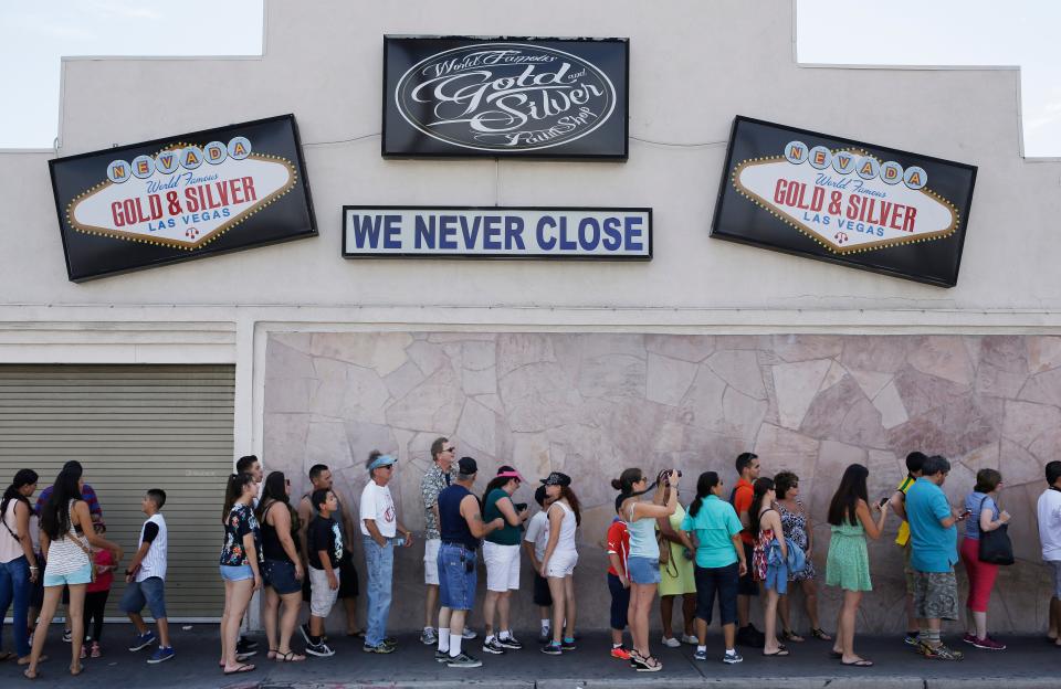 People wait in line to enter the Gold & Silver Pawn Shop in Las Vegas Monday, July 28, 2014, in Las Vegas. Rick Harrison, owner of the pawn shop and one of the stars of the reality television series Pawn Stars, has proposed building a shopping plaza on land nearby. (AP Photo/John Locher) ORG XMIT: NVJL101