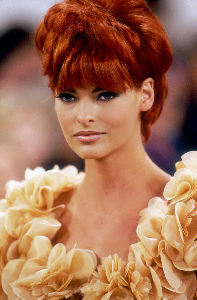 Supermodel Linda Evangelista models an outfit from Italian design house Prada's ready-to-wear collection during the spring-summer 1992 fashion show in Milan. She is wearing a dress decorated with ruche. (Photo by julio donoso/Sygma via Getty Images)