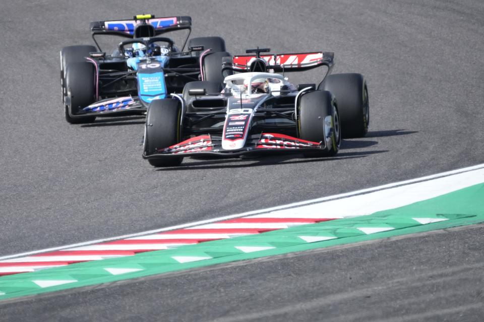 Haas driver Kevin Magnussen of Denmark, right, and Alpine driver Pierre Gasly of France, left, steer their cars during the Japanese Formula One Grand Prix at the Suzuka Circuit in Suzuka, central Japan, Sunday, April 7, 2024. (AP Photo/Hiro Komae)