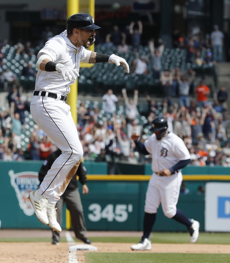 Detroit Tigers' Nicholas Castellanos reacts after teammate Christin Stewart hit a grand slam during the seventh inning of a baseball game against the Kansas City Royals, Saturday, April 6, 2019, in Detroit. (AP Photo/Carlos Osorio)