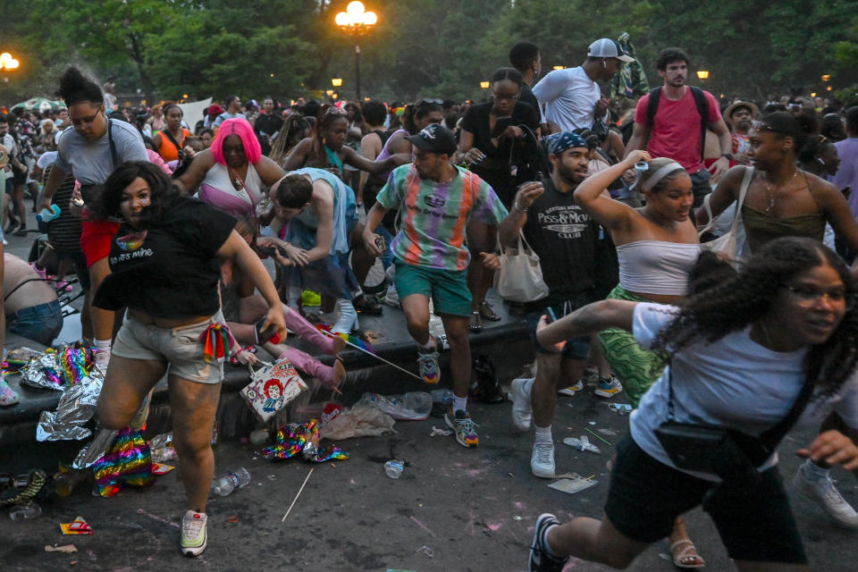 NEW YORK, NEW YORK - JUNE 26: People run out of Washington Square Park after fireworks were mistaken for gunfire following multiple Pride events earlier in the day on June 26, 2022 in New York City. NYPD confirmed there were no shots fired, although moments after several fights broke out resulting in multiple arrests including one person being taken away in an ambulance.  (Photo by Alexi Rosenfeld/ Getty Images)