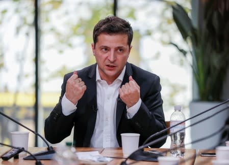 Ukraine's President Volodymyr Zelenskiy holds a press-marathon at a food market in Kiev