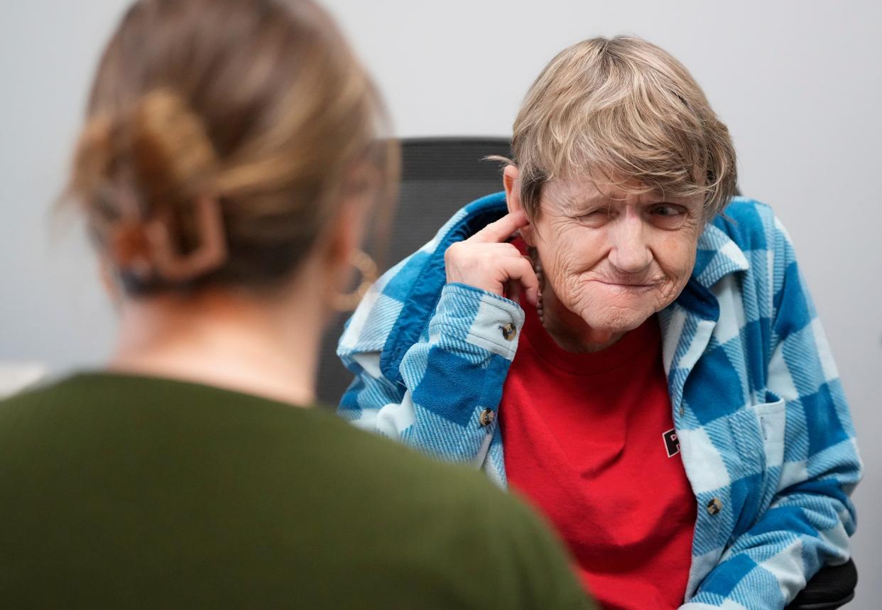 Dr. Kailey Murphy talks to Sue Smith about her new hearing aids last month. Despite lifelong hearing problems, Smith, 71, didn't get her first hearing aids until she was in her 60s.