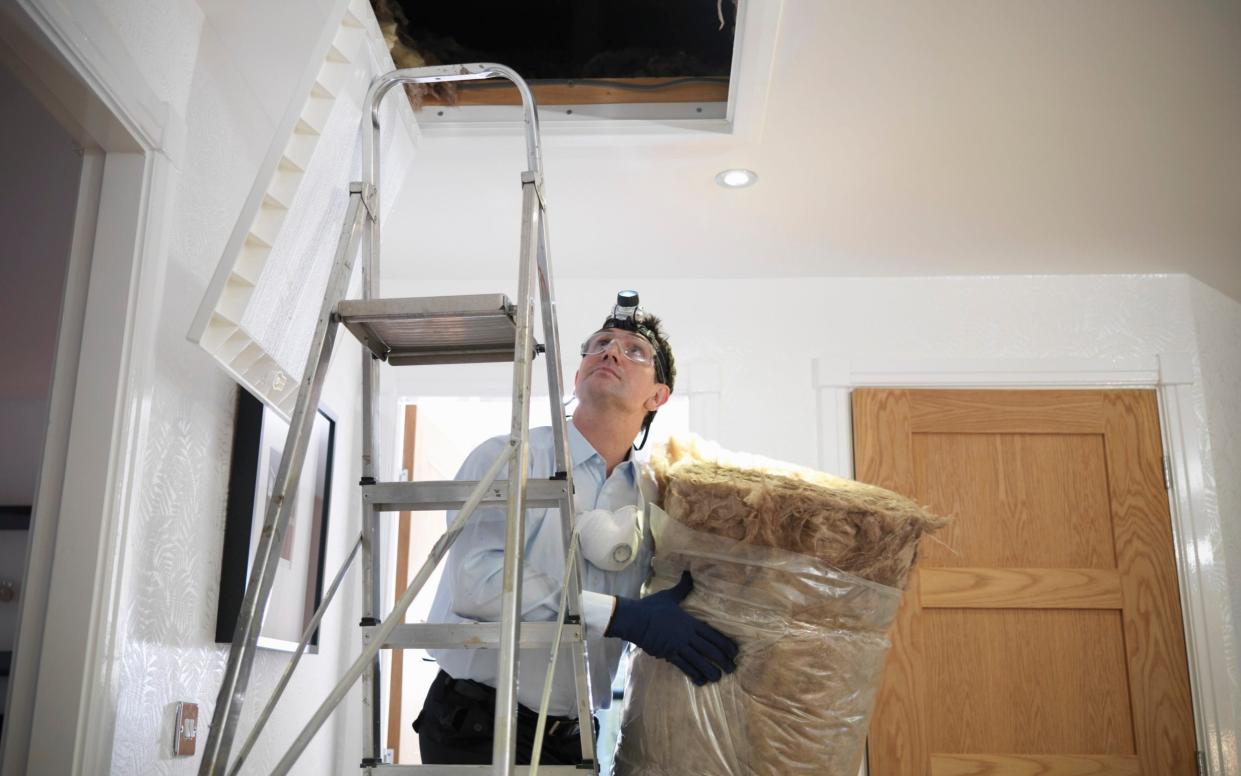 Man prepares to insulate loft in house