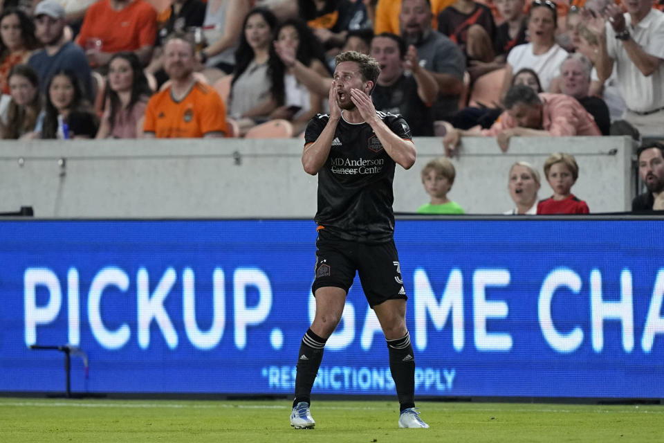Houston Dynamo's Adam Lundqvist reacts after being issued a red card during the first half of a soccer match against the Nashville SC Saturday, May 14, 2022, in Houston. (AP Photo/David J. Phillip)