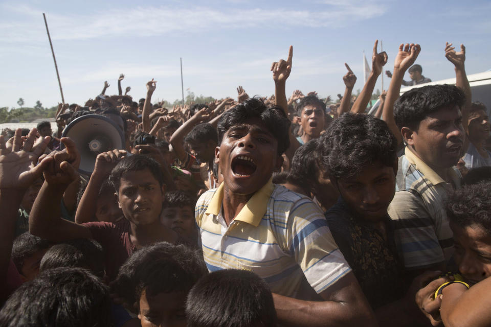 FILE - In this file photo dated Thursday, Nov. 15, 2018, Rohingya refugees shout slogans during a protest against the repatriation process at Unchiprang refugee camp near Cox's Bazar, in Bangladesh. Sexual violence carried out by Myanmar's security forces against the country's Muslim Rohingya minority was so widespread and severe that it demonstrates intent to commit genocide as well as warrants prosecution for war crimes and crimes against humanity, according to a U.N. report released Thursday Aug. 22, 2019. The Rohingya refugees still live in squalid camps in Bangladesh, and a planned effort Thursday to repatriate an initial large group to Myanmar collapsed when none showed up to be taken back. (AP Photo/Dar Yasin, FILE)