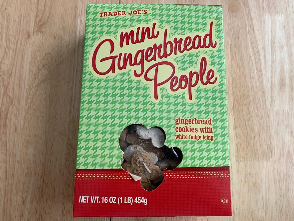 green and red box of trader joes mini gingerbread people on wood table