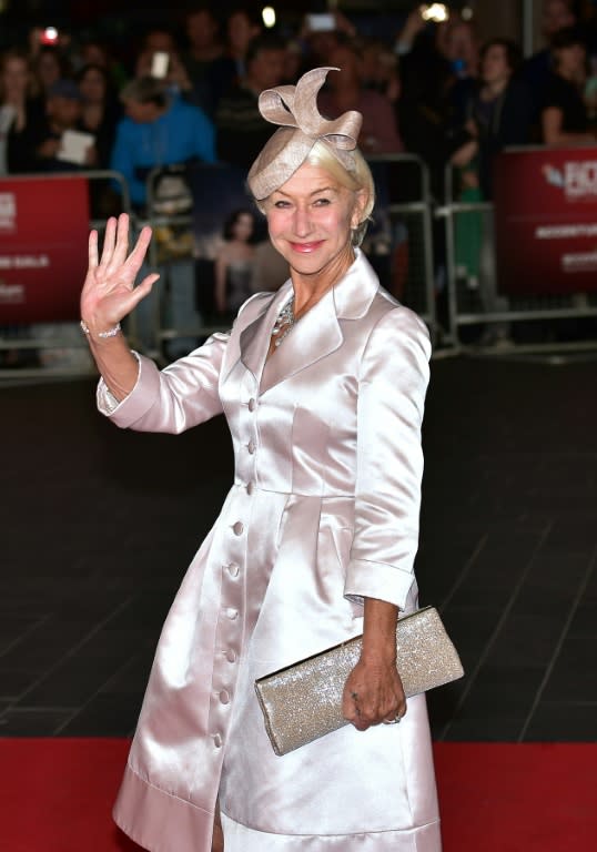 British actress Helen Mirren waves as she arrives for the European premiere of the film "Trumbo" during the BFI London Film Festival in Leicester Square on October 8, 2015