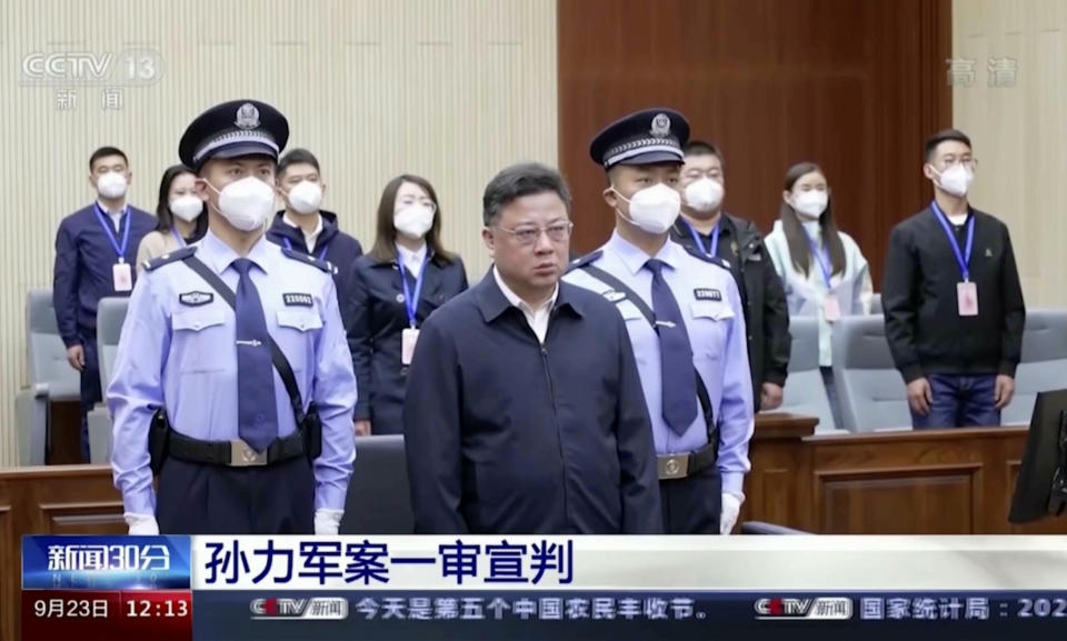 In this image taken from video footage run by China's CCTV, Sun Lijun, former vice minister of public security, attends a court sentencing in Changchun in northeastern China's Jilin province on Friday, Sept. 23, 2022. The former deputy Chinese police minister who was accused of leading a crime gang of government officials was given a death sentence with a two-year reprieve Friday on charges of manipulating the stock market, taking bribes and other offenses, state TV reported Friday, Sept. 23, 2022 (CCTV via AP)