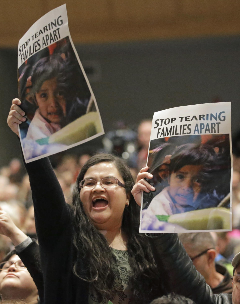 A woman shouts during Republican U.S. Rep. Chris Stewart town hall meeting Friday, March 31, 2017, in Salt Lake City. Stewart says he knows that many of those attending his town hall in heavily Democratic Salt Lake City probably didn't vote for him, but the Republican congressman says he feels it's important to appear before his constituents. (AP Photo/Rick Bowmer)