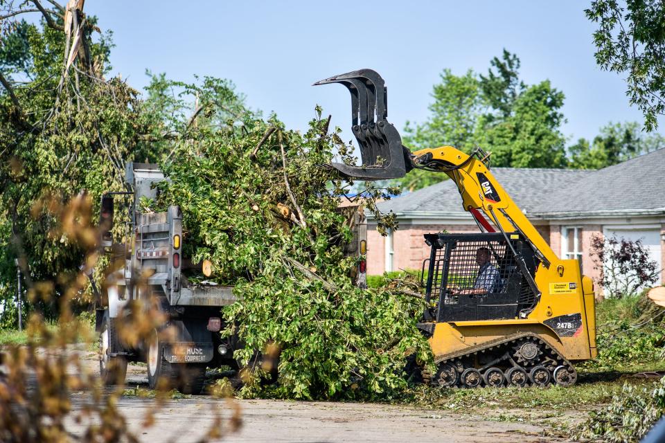 Volunteer groups and residents worked together Saturday, June 1 to clear debris from some of the neighborhoods in Trotwood and other areas hit by the tornado last Monday. (WHIO File)