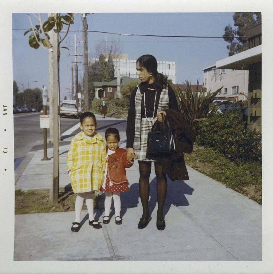 This January 1970 photo provided by the Kamala Harris campaign shows her, left, with her sister, Maya, and mother, Shyamala, outside their apartment in Berkeley, Calif., after her parents’ separation.