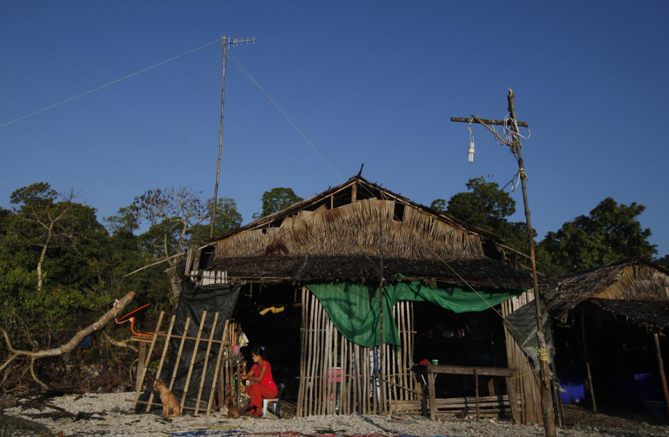 In this Feb. 11, 2014 photo, a Myanmarese woman cooks food inside her hut at Ma Kyone Galet village, inhabited by Moken and Myanmarese fishermen, on Bocho Island in Mergui Archipelago, Myanmar. The village, located within the Lampi National Park, is home to 480 Burmese and other ethnic groups, 280 Moken and 146 from Moken-Burmese marriages, as of a 2012 count. Isolated for decades by the country’s former military regime and piracy, the Mergui archipelago is thought by scientists to harbor some of the world’s most important marine biodiversity and looms as a lodestone for those eager to experience one of Asia’s last tourism frontiers before, as many fear, it succumbs to the ravages that have befallen many of the continent’s once pristine seascapes. (AP Photo/Altaf Qadri)