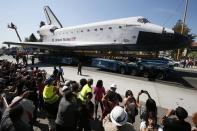 The space shuttle Endeavour is moved to the California Science Center in Los Angeles on Saturday, Oct. 13, 2012. (AP Photo/Lucy Nicholson, Pool)
