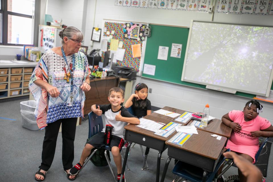 College Park Elementary School second grade teacher Lisa Schermerhorn talks to her class on Sept. 9 after she received her Amazing Teacher award check from Gannett and the Florida Credit Union.
