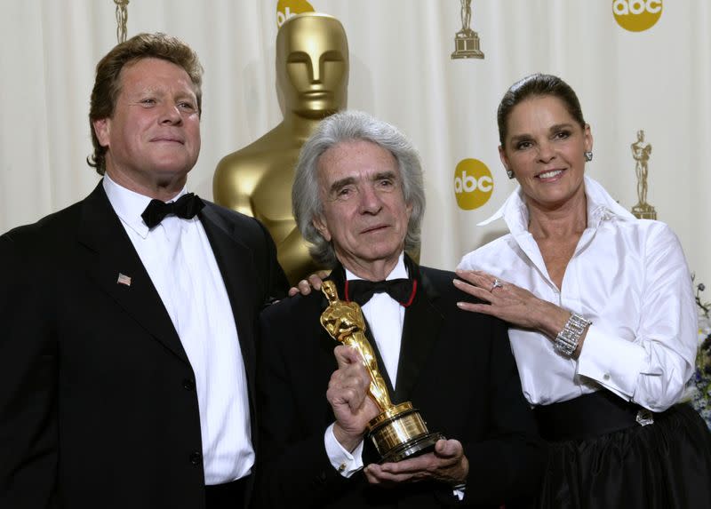 Arthur Hiller holds his Jean Hersholt Humanitarian Award while standing with Ryan O'Neal and Ali McGraw during the 74th annual Academy Awards in Hollywood