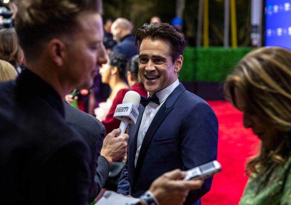Actor Colin Farrell of "The Banshees of Inisherin" talks to interviewers on the red carpet at the Palm Springs International Film Awards in Palm Springs, Calif., Thursday, Jan. 5, 2023. 