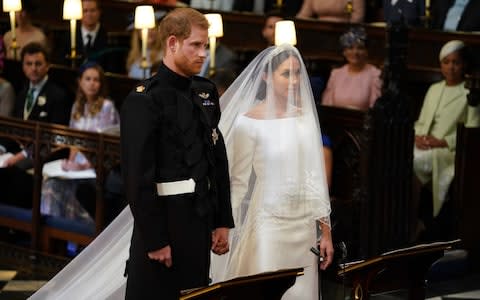 Prince Harry and Meghan Markle in St George's Chapel at Windsor Castle  - Credit: PA