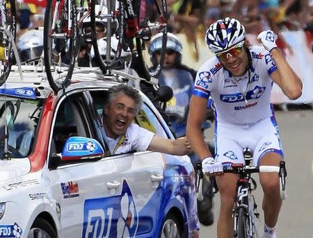 FDJ-Bigmat rider Thibaut Pinot of France is cheered by FDJ sport director Marc Madiot (L) as he wins the eighth stage of the 99th Tour de France cycling race between Belfort and Porrentruy, July 8, 2012. REUTERS/Jean-Paul Pelissier