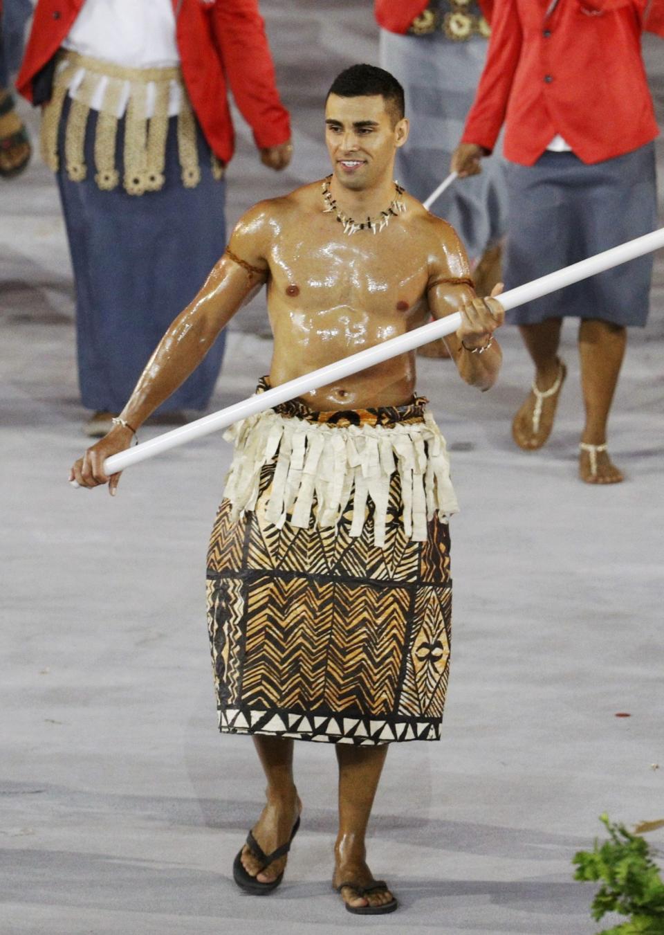 <p>Flagbearer Pita Nikolas Taufatofua (TGA) of Tonga leads his contingent during the athletes’ parade at the opening ceremony. REUTERS/Stoyan Nenov </p>