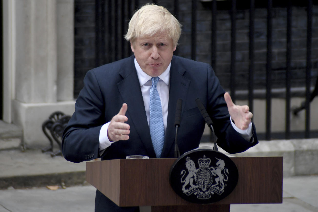 Britain's Prime Minister Boris Johnson speaks to the media outside 10 Downing Street in London, Monday, Sept. 2, 2019. Johnson says he doesn't want an election amid the Brexit crisis and issued a rallying cry to lawmakers to back him in securing a Brexit deal. (AP Photo/Alberto Pezzali)