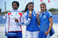 Silver medalist Teresa Nzola Meso Ba of France, gold medalist Athanasia Perra and bronze medalist Paraskevi Papachristou of Greece pose for the photographers after the Women's Triple Jump Final during the XVI Mediterranean Games on July 3, 2009 in Pescara, Italy. (Photo by Getty Images)