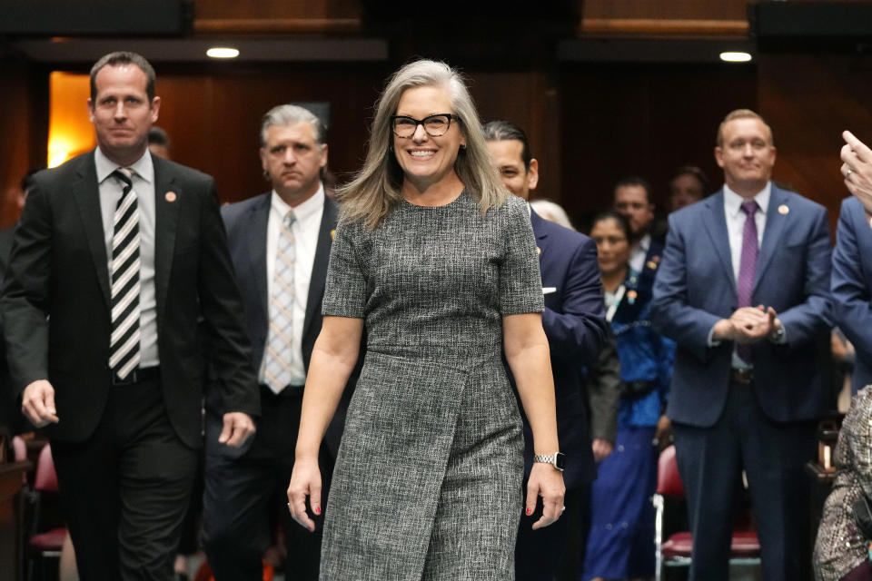 Arizona Democratic Gov. Katie Hobbs smiles as she arrives to give the state of the state address at the Arizona Capitol in Phoenix, Monday, Jan. 9, 2023. (AP Photo/Ross D. Franklin)