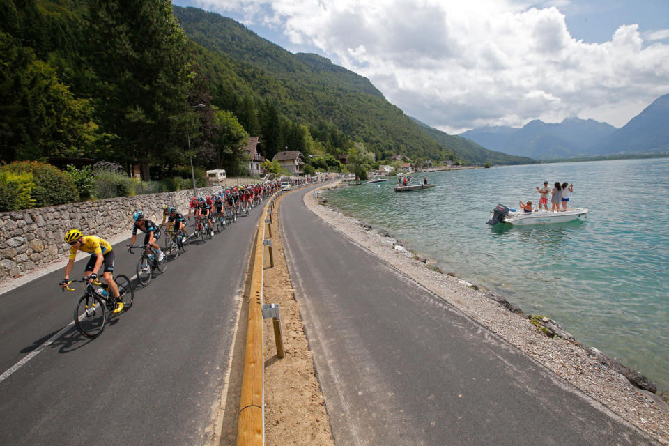 <p>The pack with Britain’s Chris Froome, wearing the overall leader’s yellow jersey, rides along Annecy Lake during the nineteenth stage of the Tour de France cycling race over 146 kilometers (90.7 miles) with start in Albertville and finish in Saint-Gervais Mont Blanc, France, Friday, July 22, 2016. (AP Photo/Christophe Ena)</p>