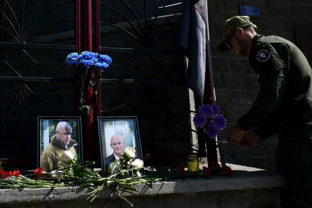 A member of private mercenary group Wagner pays tribute to Yevgeny Prigozhin (AFP via Getty Images)