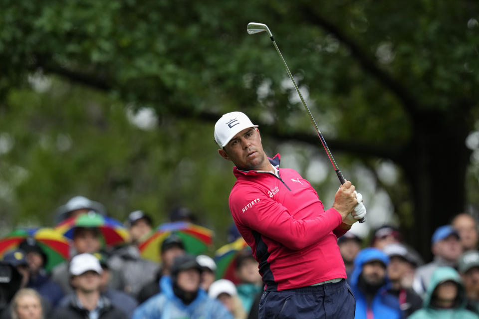 FILE - Gary Woodland watches his tee shot on the fourth hole during the weather-delayed third round of the Masters golf tournament at Augusta National Golf Club on April 8, 2023, in Augusta, Ga. Woodland returns to competition at the Sony Open following Sept. 18, 2023, brain surgery. (AP Photo/Mark Baker, File)