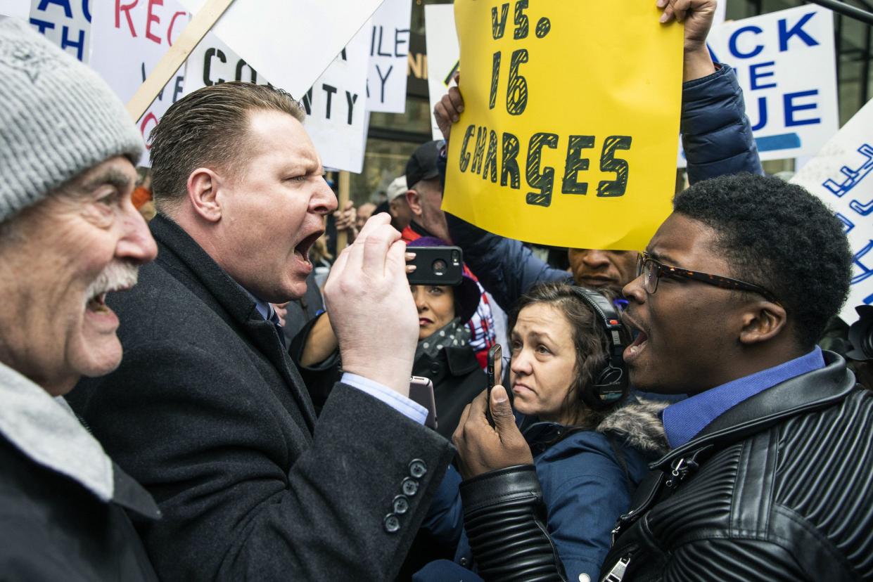 Former mayoral candidate and community activist Ja'Mal Green, right, verbally spars with Fraternal Order of Police supporters protesting against Cook County State's Attorney Kim Foxx outside the county administration building, on April 1, 2019. Dueling rallies in downtown Chicago supported and criticized Foxx's performance in the Jussie Smollett case.