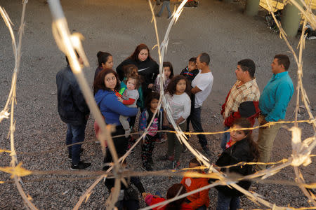 Migrants from Central America wait inside of an enclosure, where they are being held by U.S. Customs and Border Protection (CBP), after crossing the border between Mexico and the United States illegally and turning themselves in to request asylum, in El Paso, Texas, U.S., March 29, 2019. REUTERS/Lucas Jackson