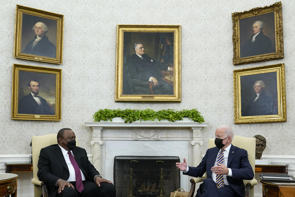President Joe Biden, right, speaks as Kenyan President Uhuru Kenyatta, left, listens during their meeting in the Oval Office of the White House in Washington, Thursday, Oct. 14, 2021. (AP Photo/Susan Walsh)