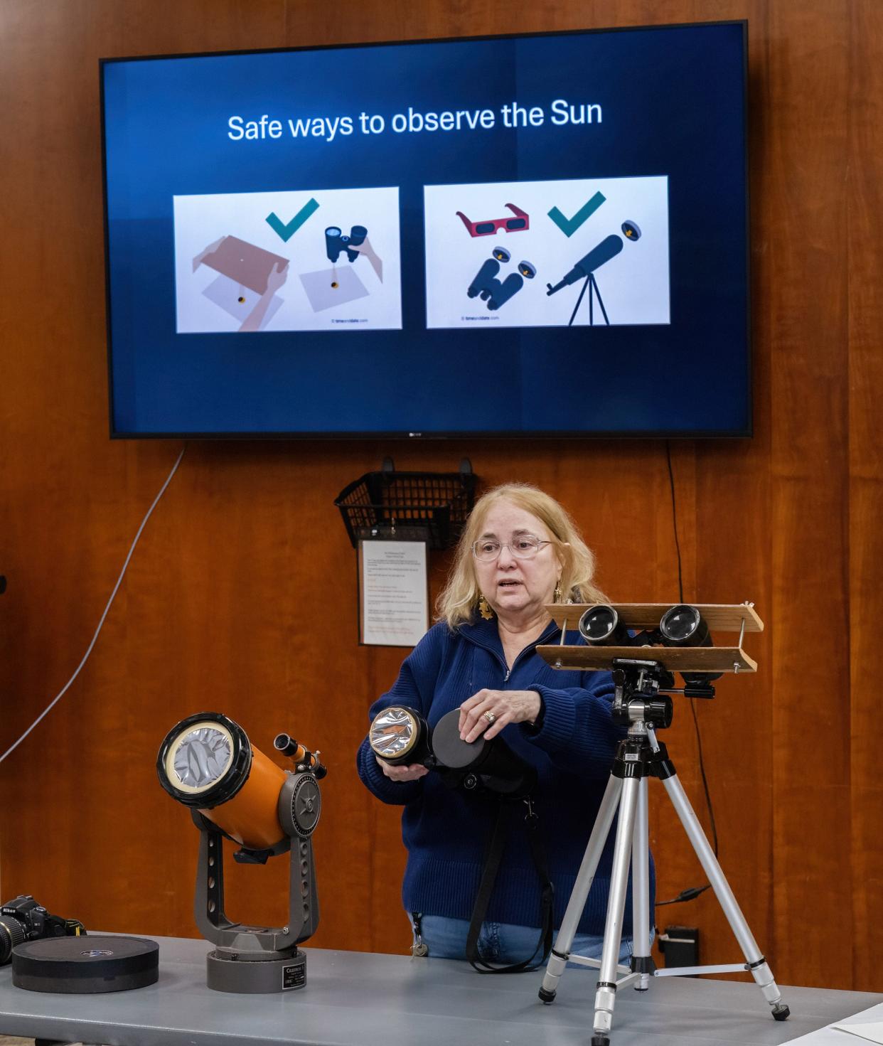 Robin Gill, astronomy education specialist at The Wilderness Center in Sugar Creek Township, conducts a program on how to successfully and safely view the solar eclipse.