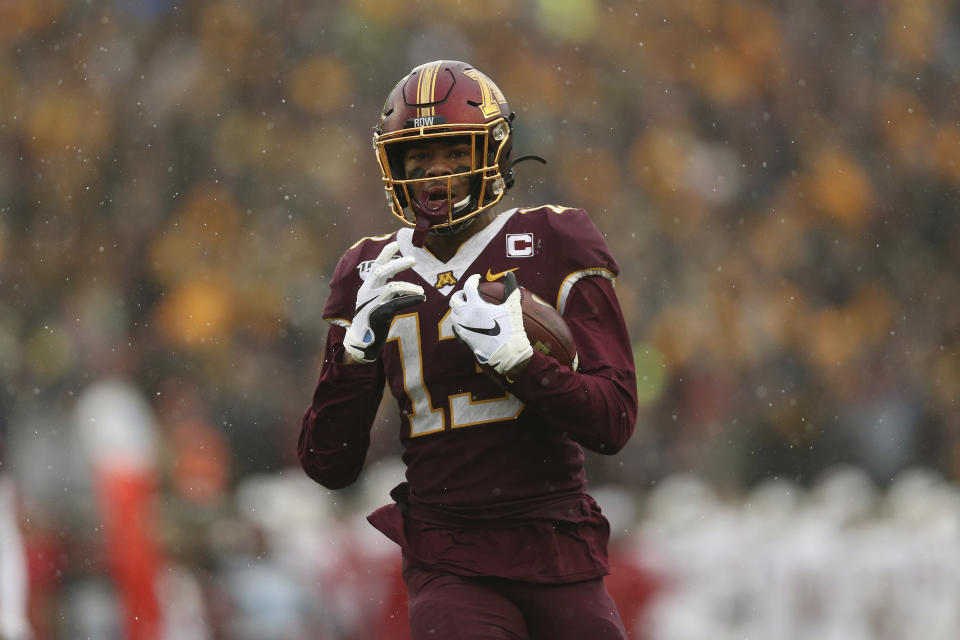 Minnesota wide receiver Rashod Bateman (13) carries the ball into the end zone for a touchdown against Wisconsin during the first half of an NCAA college football game Saturday, Nov. 30, 2019, in Minneapolis. (AP Photo/Stacy Bengs)