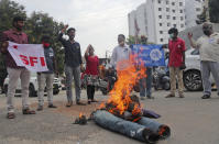 Student activists shout slogans while burning an effigy of Uttar Pradesh state Chief Minister Yogi Adityanath during a protest against the gang rape and killing of a teenager, in Hyderabad, India, Thursday, Oct. 1, 2020. The gang rape and death of a woman from the lowest rung of India’s caste system sparked outrage across the country on Wednesday, with several politicians and activists demanding justice and protesters rallying in the streets. The attack of the 19-year-old is the latest gruesome case of sexual violence against women to rile India, where reports of rape are hauntingly familiar. (AP Photo/Mahesh Kumar A.)