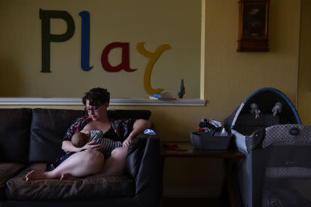 Lauren Hoffmann, 29, a college program manager, nurses her son Micah during her last week of maternity leave in San Antonio, Texas, U.S., February 7, 2019. REUTERS/Callaghan O'Hare