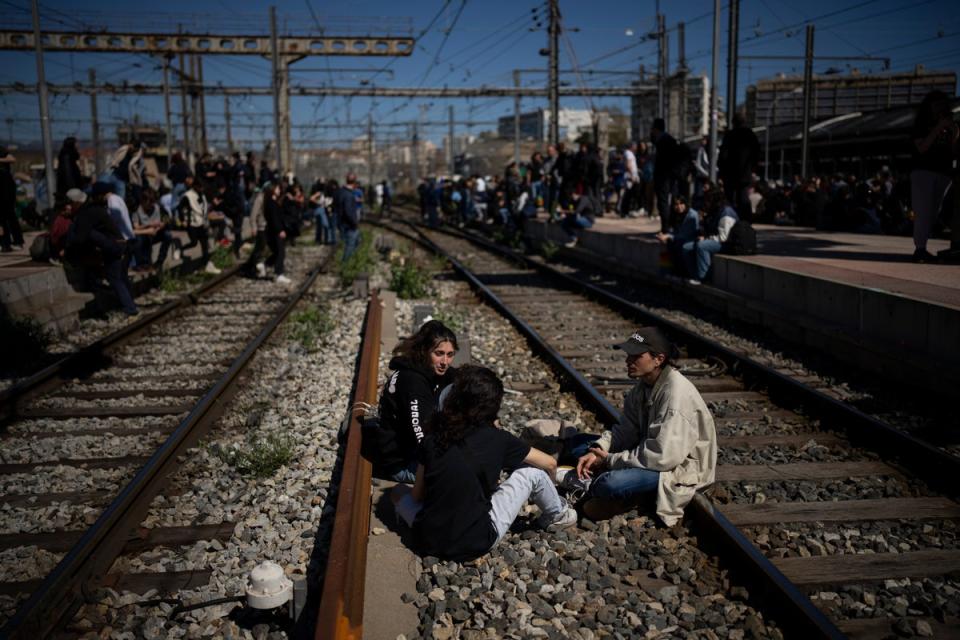 Protesters at St Charles station near Marseille on Tuesday (AP)